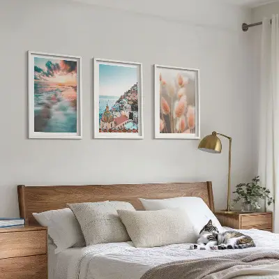 Fotowand met een zonsondergang bij de zee met huizen en bloemen