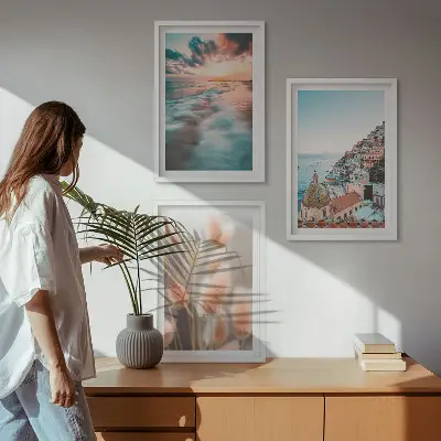 Fotowand met een zonsondergang bij de zee met huizen en bloemen