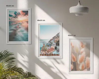 Fotowand met een zonsondergang bij de zee met huizen en bloemen