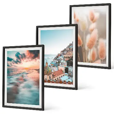 Fotowand met een zonsondergang bij de zee met huizen en bloemen