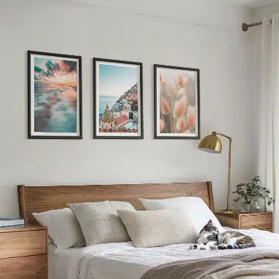 Fotowand met een zonsondergang bij de zee met huizen en bloemen