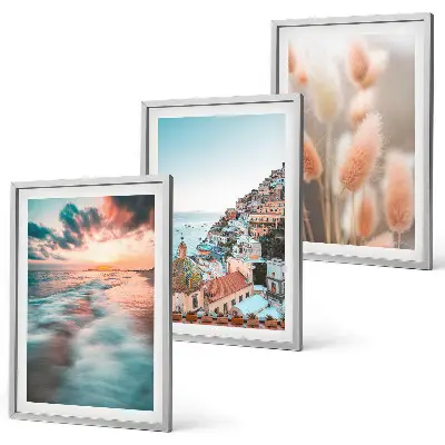 Fotowand met een zonsondergang bij de zee met huizen en bloemen