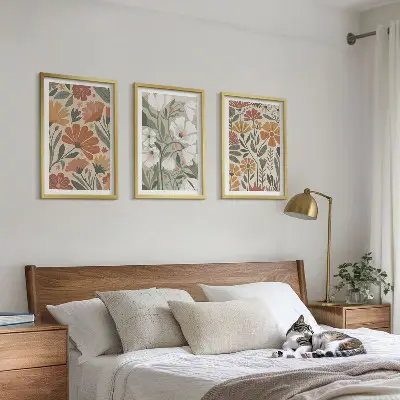 Set schilderijen voor wanddecoratie met oranje en groene bloemmotieven