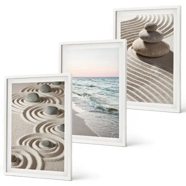 Fotowand met zandgolven, water en stenen op het strand