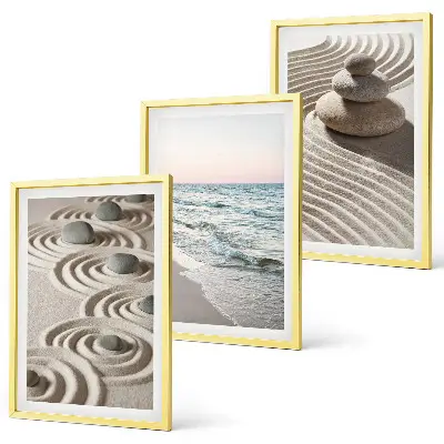 Fotowand met zandgolven, water en stenen op het strand