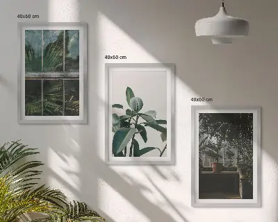 Wanddecoratieset schilderijen groene bladeren bij een raam met planten