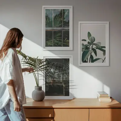 Wanddecoratieset schilderijen groene bladeren bij een raam met planten