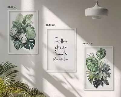 Set wanddecoratie met schilderijen met tropische groene bladeren