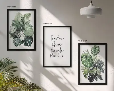 Set wanddecoratie met schilderijen met tropische groene bladeren