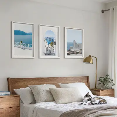 Wanddecoratieset schilderijen met afbeelding van witte gebouwen aan de zee in Griekenland