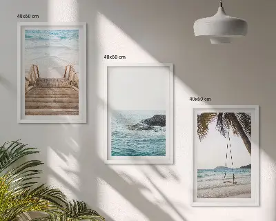 Wanddecoratieset schilderijen met een trap bij het strand en een schommel aan de zee