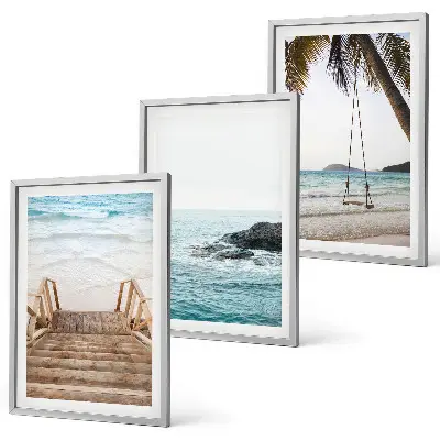 Wanddecoratieset schilderijen met een trap bij het strand en een schommel aan de zee