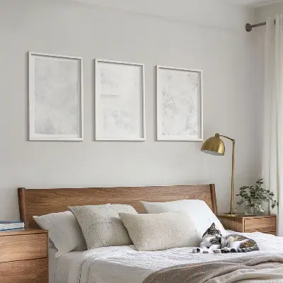 Wanddecoratieset schilderijen met minimalistische witte vlekken op een achtergrond