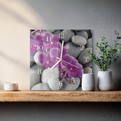 Vierkante glazen wandklok Stenen en orchidee