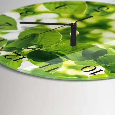 Klok glas met opdruk rond Bladeren