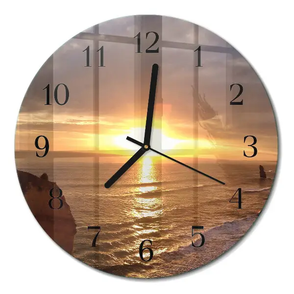 Klok glas met opdruk rond Zonsondergang