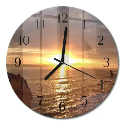 Klok glas met opdruk rond Zonsondergang