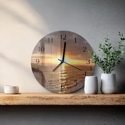 Klok glas met opdruk rond Zonsondergang