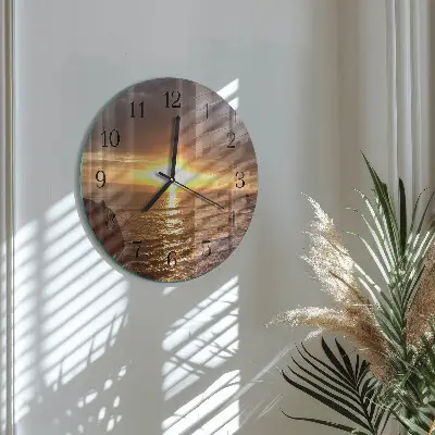 Klok glas met opdruk rond Zonsondergang