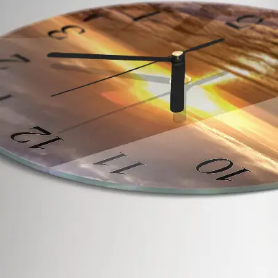 Klok glas met opdruk rond Zonsondergang