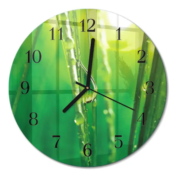 Ronde glas klok Druppels op het gras