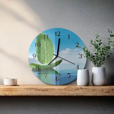Klok glas met opdruk rond Bladeren