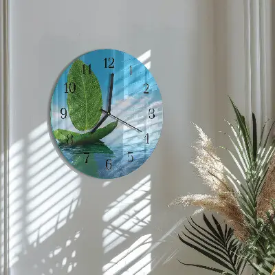 Klok glas met opdruk rond Bladeren