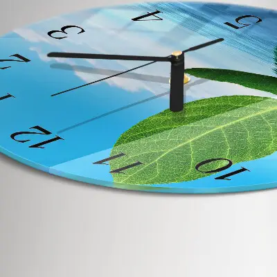Klok glas met opdruk rond Bladeren