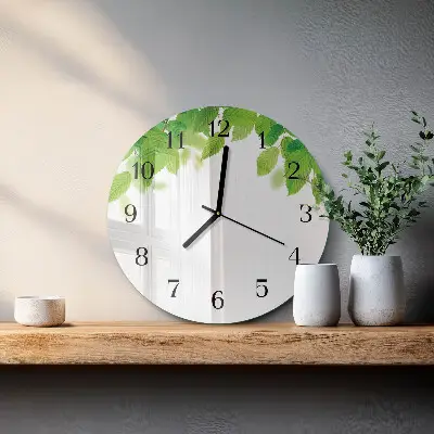 Klok glas met opdruk rond Bladeren