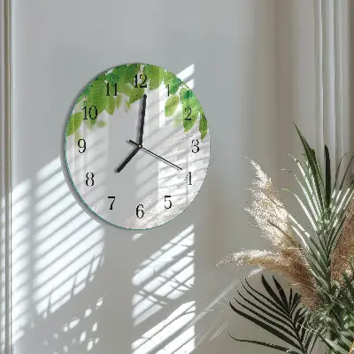Klok glas met opdruk rond Bladeren
