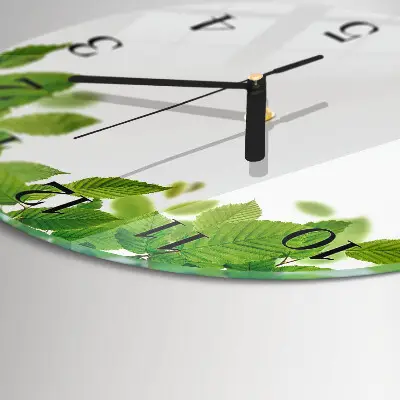 Klok glas met opdruk rond Bladeren